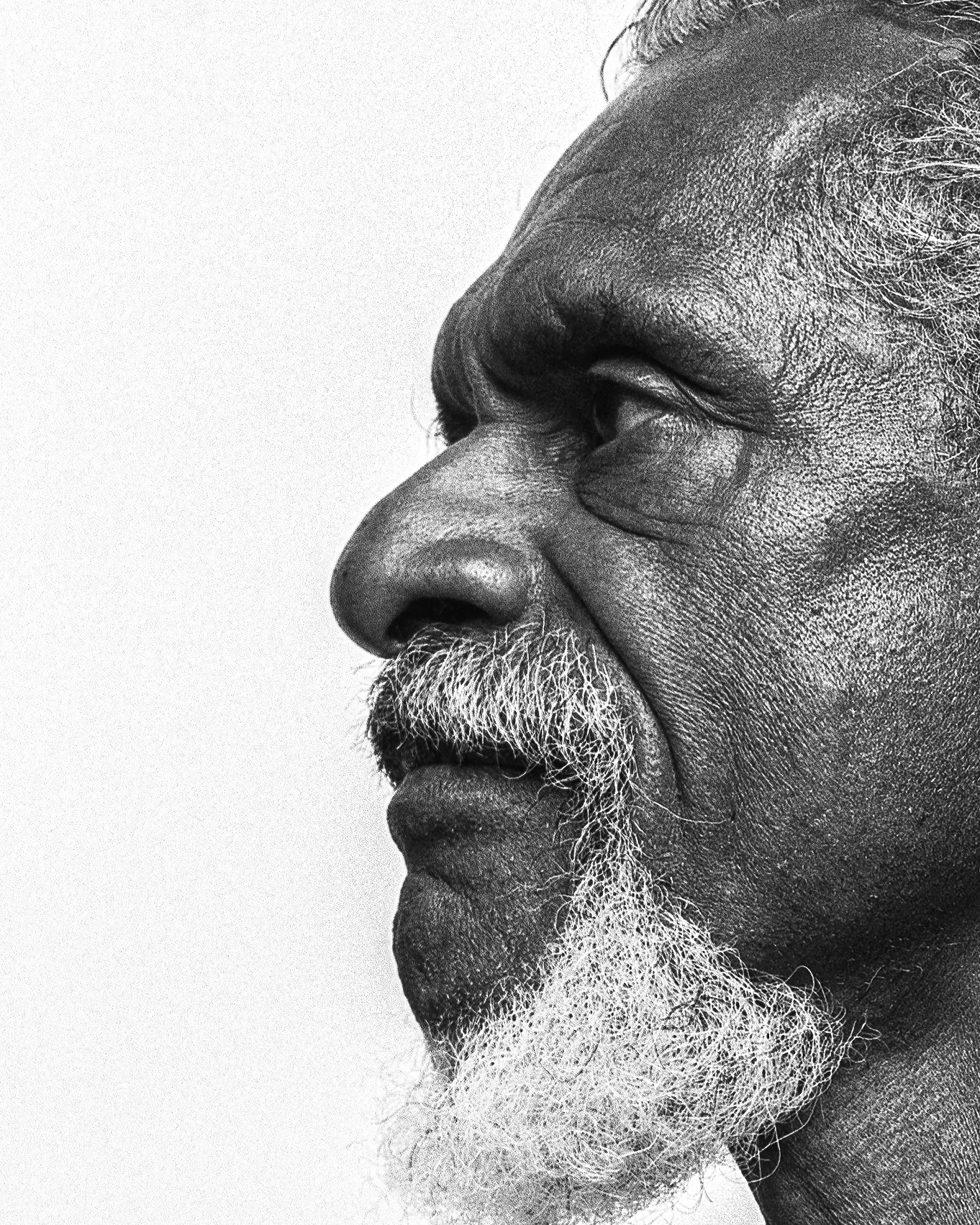 half portrait of Uncle Mark Cora in black and white, shot at Blanc Studio Byron Bay